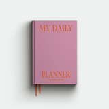 Pink planner with 'My Daily Planner' text on a light gray background